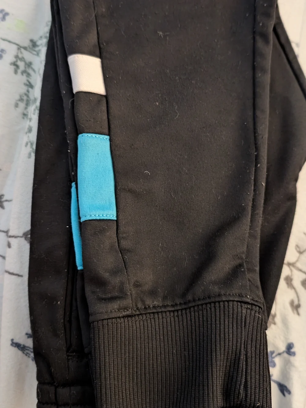 New Balance Black Jacket with Blue and White Stripes